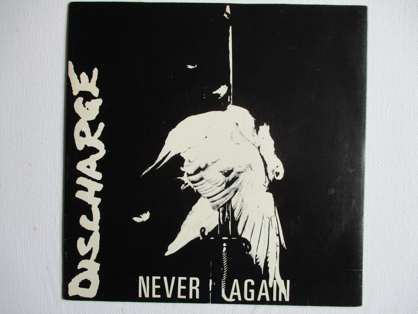 DISCHARGE never again 7" VG+ EX