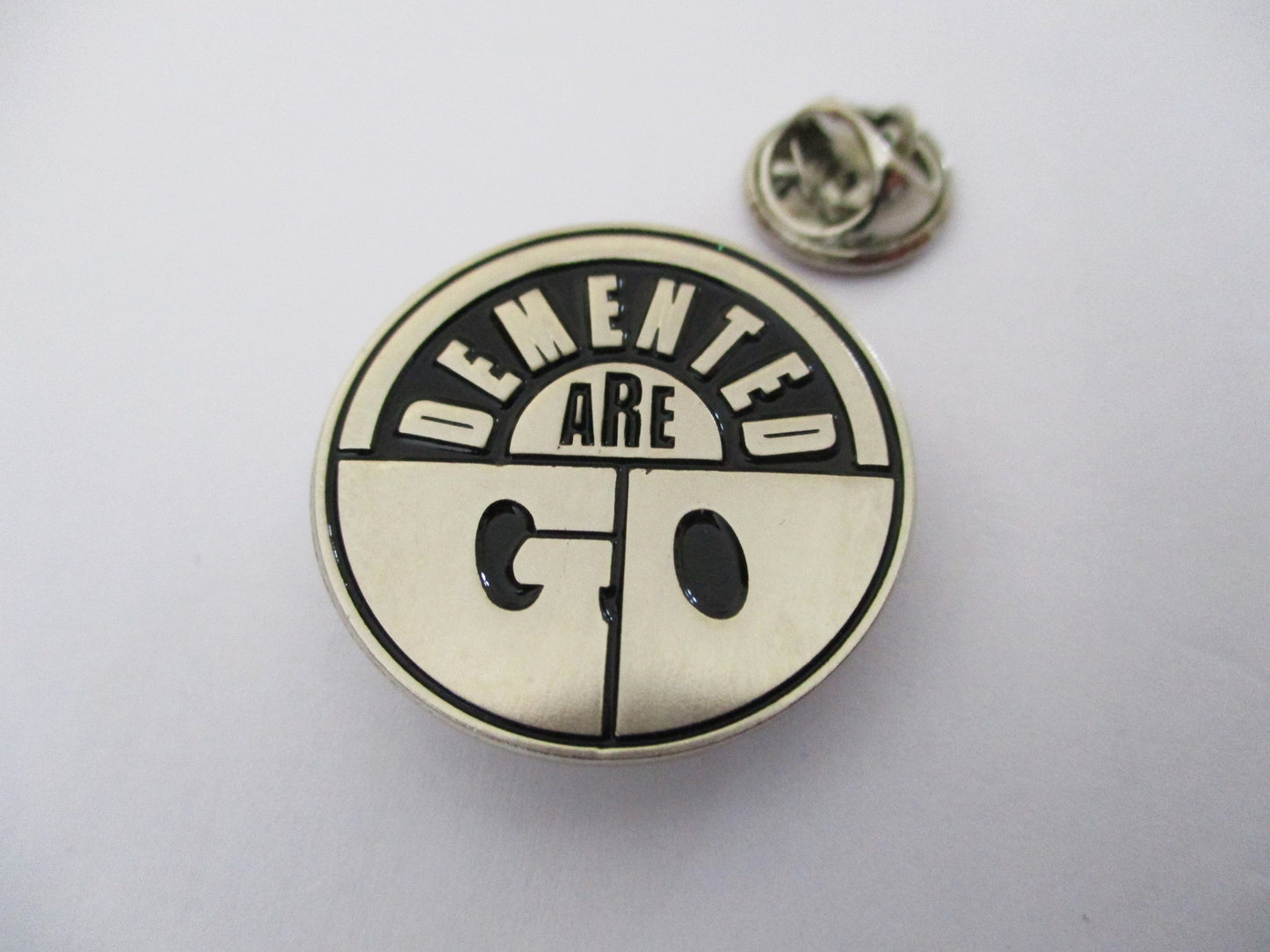 DEMENTED ARE GO logo PSYCHOBILLY METAL BADGE silver