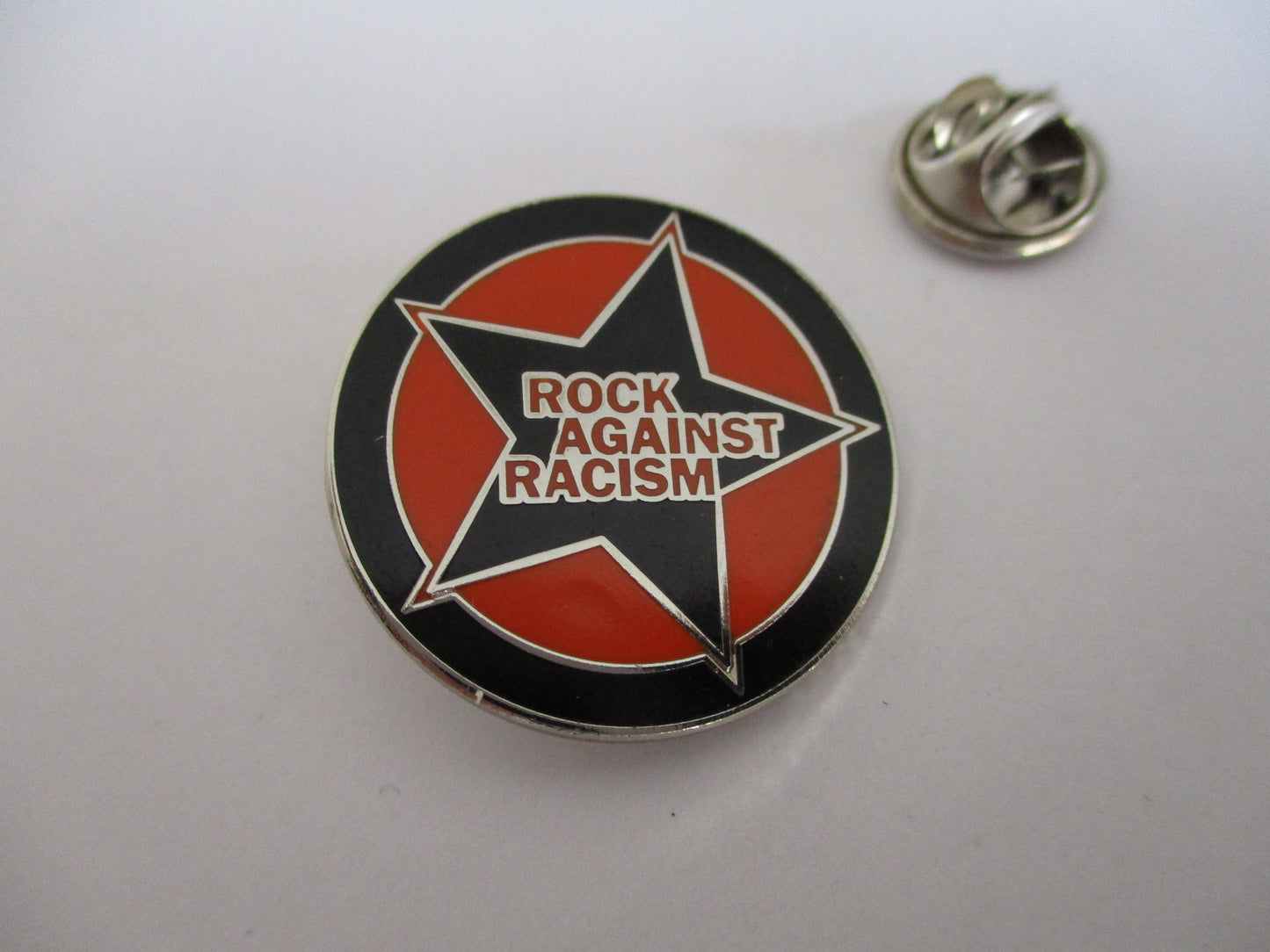 ROCK AGAINST RACISM PUNK METAL BADGE (orange)