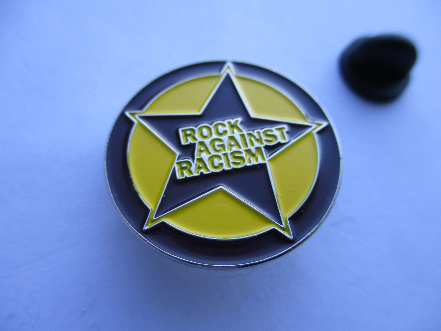 ROCK AGAINST RACISM metal badge (purple)