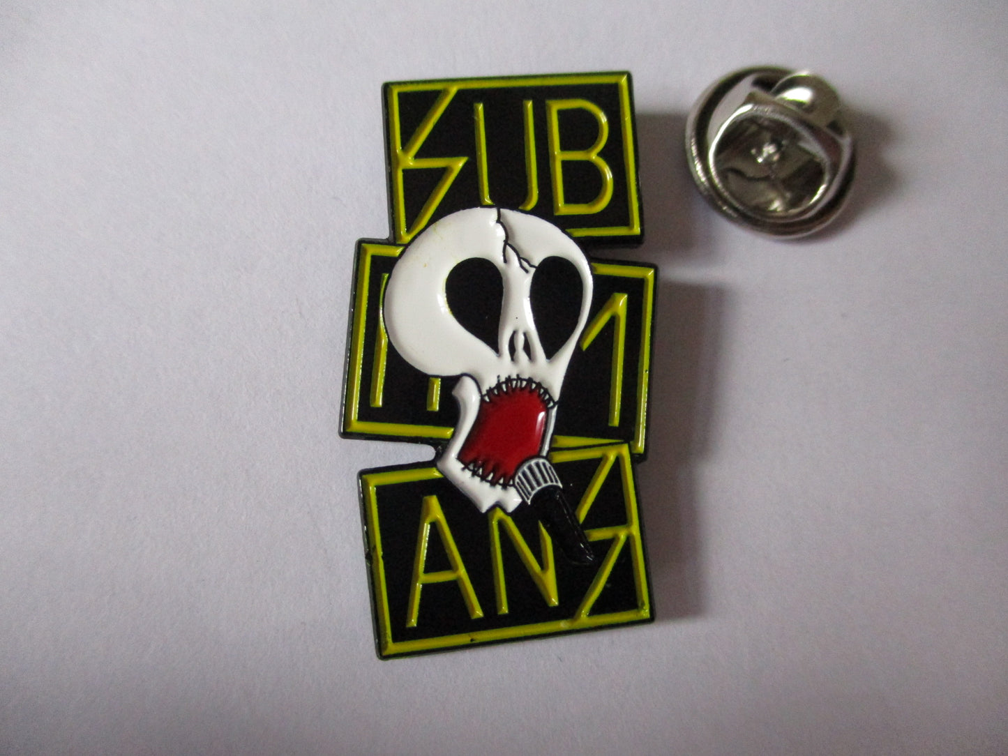 THE SUBHUMANS anarcho punk METAL BADGE (yellow logo)