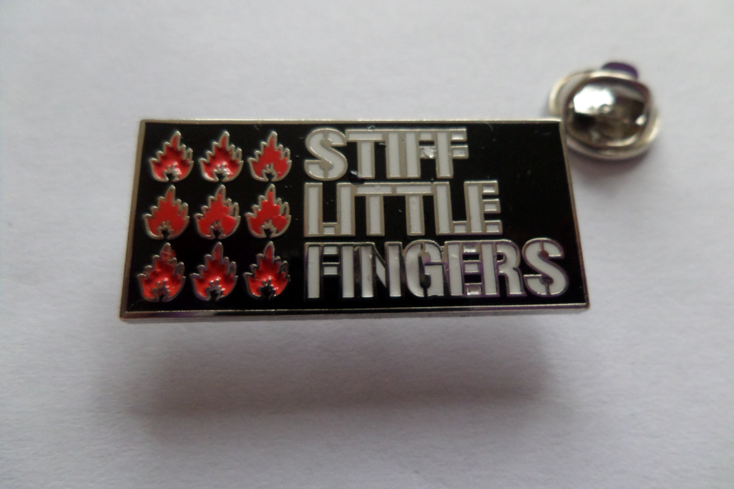 STIFF LITTLE FINGERS inflammable material PUNK METAL BADGE - Savage Amusement
