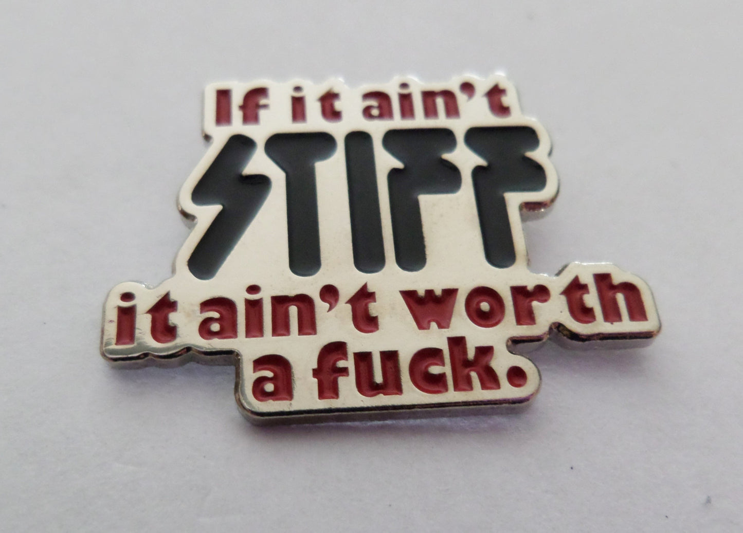 STIFF RECORDS shaped PUNK METAL BADGE