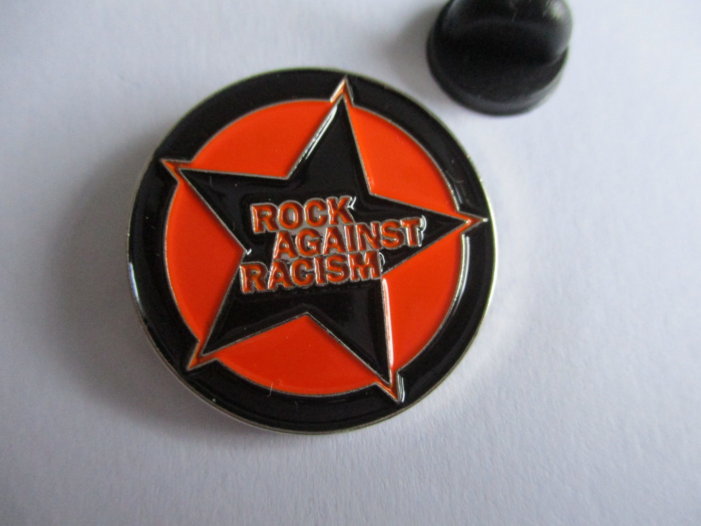 ROCK AGAINST RACISM PUNK METAL BADGE (orange)