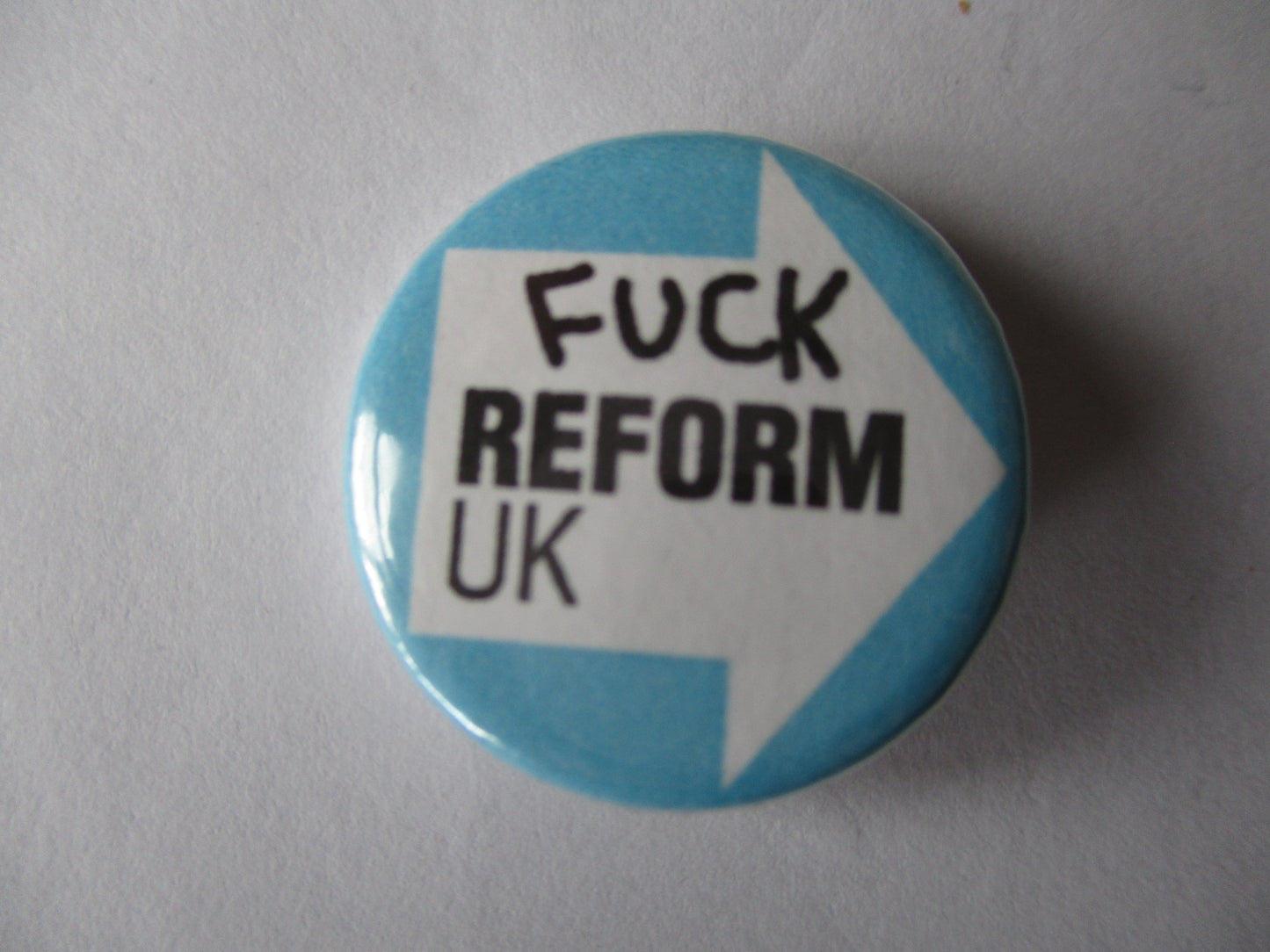 FUCK REFORM badge (turquoise)