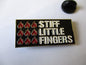 STIFF LITTLE FINGERS inflammable material PUNK METAL BADGE - Savage Amusement