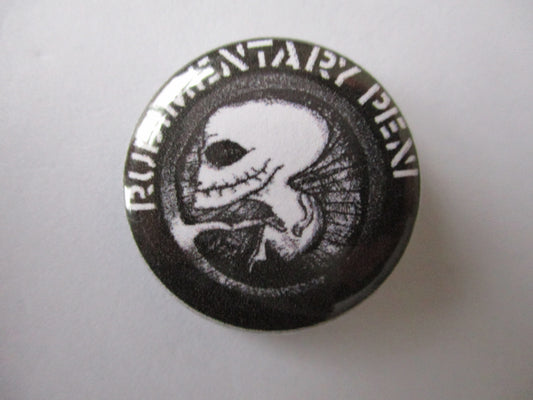 RUDIMENTARY PENI womb logo punk badge