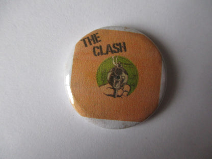 THE CLASH punk badge (VARIOUS OUT OF PRINT, discoloured)