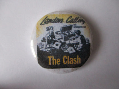 THE CLASH punk badge (VARIOUS OUT OF PRINT, discoloured)